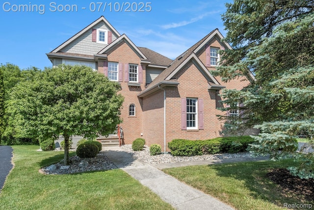 6161 Golfside Ct, Grand Blanc, MI 48439 - view of front of home featuring brick siding and a front lawn