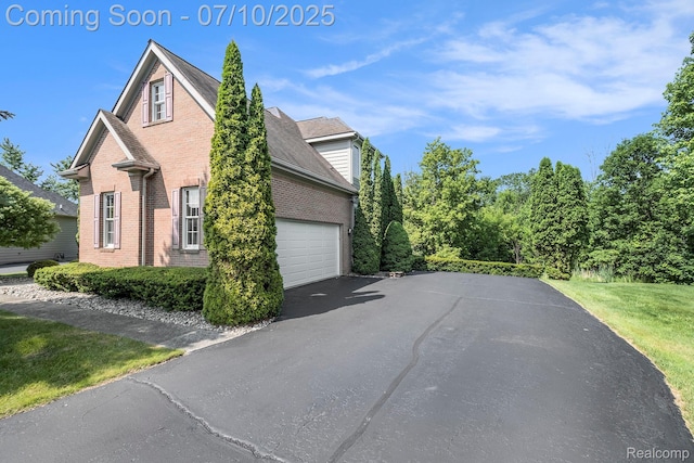 6161 Golfside Ct, Grand Blanc, MI 48439 - view of side of home with brick siding and driveway
