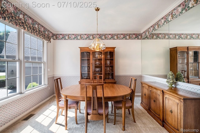 6161 Golfside Ct, Grand Blanc, MI 48439 - dining space with a chandelier, wainscoting, wallpapered walls, light carpet, and ornamental molding