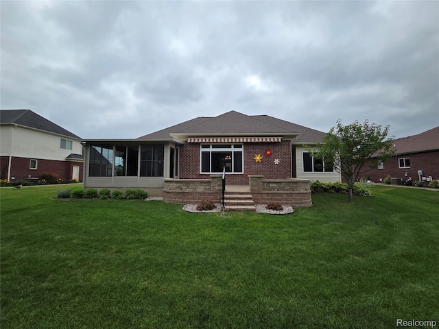 2181 E Shore Dr, Rochester Hills, MI 48307 - back of house featuring a yard, a sunroom, brick siding, and a shingled roof