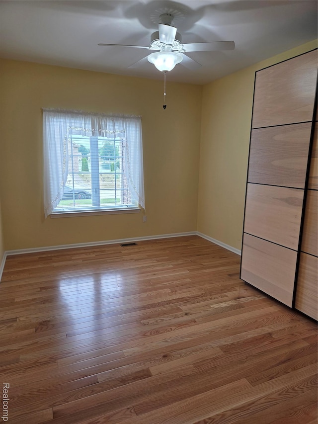 2181 E Shore Dr, Rochester Hills, MI 48307 - unfurnished bedroom featuring light wood-type flooring and ceiling fan