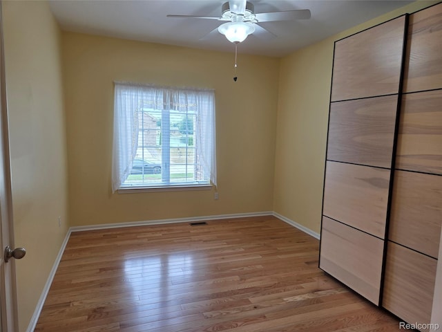 2181 E Shore Dr, Rochester Hills, MI 48307 - unfurnished bedroom with light wood-type flooring and a ceiling fan