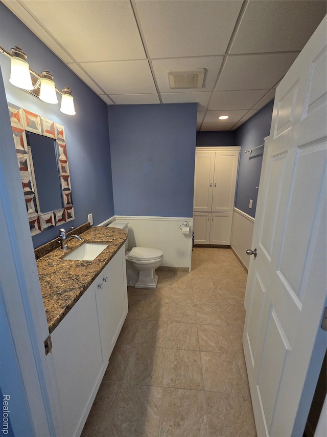 2181 E Shore Dr, Rochester Hills, MI 48307 - bathroom featuring a paneled ceiling, vanity, and a wainscoted wall
