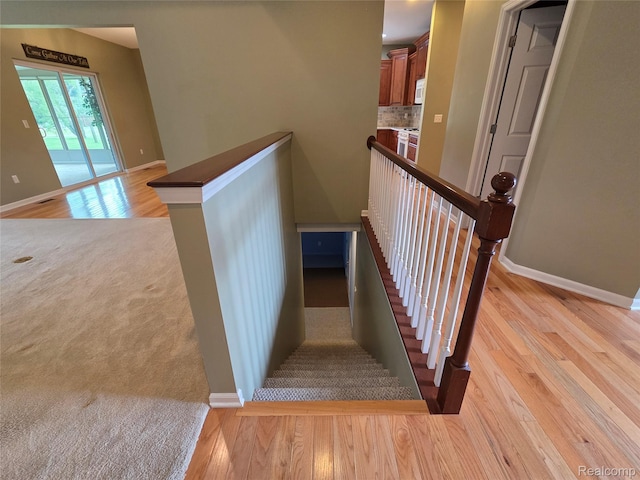 2181 E Shore Dr, Rochester Hills, MI 48307 - stairway featuring wood finished floors and baseboards