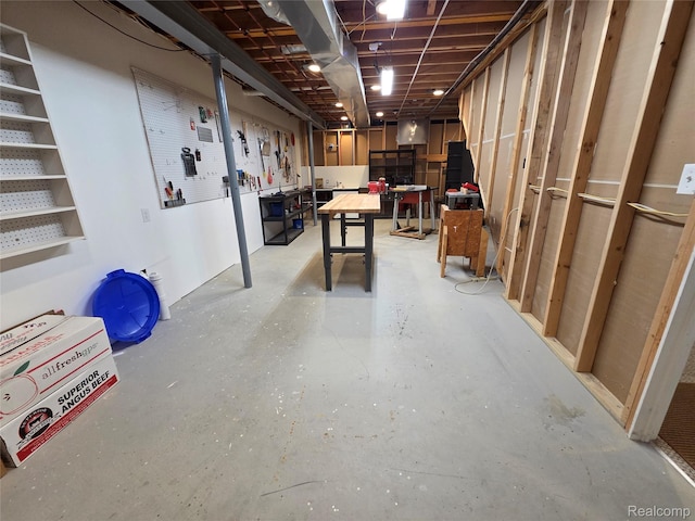 2181 E Shore Dr, Rochester Hills, MI 48307 - unfinished basement featuring a workshop area