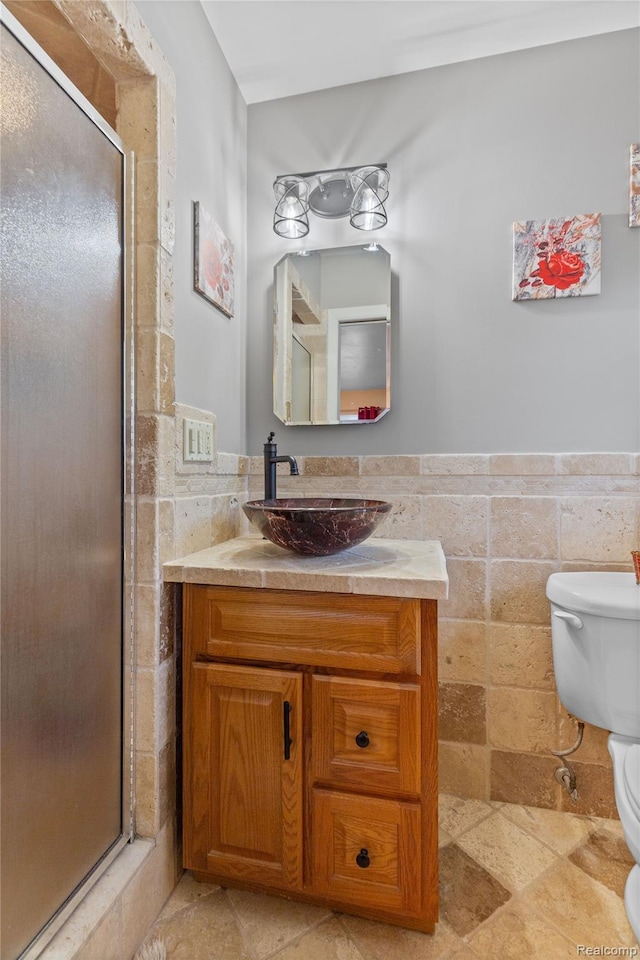 26714 Dover Ct, Warren, MI 48089 - bathroom featuring tile walls, vanity, a stall shower, and wainscoting