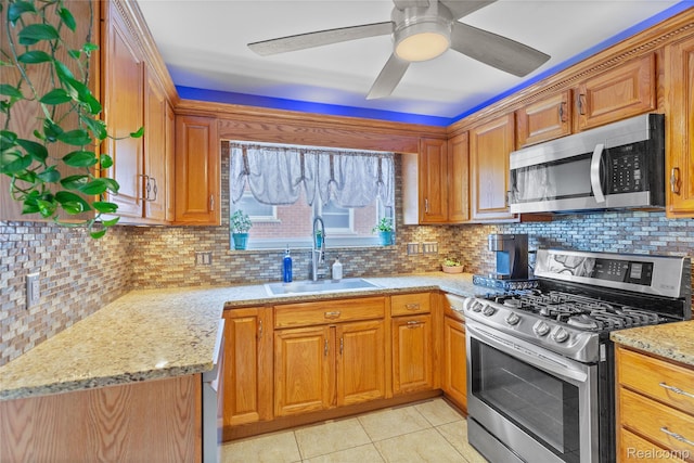 26714 Dover Ct, Warren, MI 48089 - kitchen featuring stainless steel appliances, ceiling fan, light tile patterned floors, decorative backsplash, and brown cabinets
