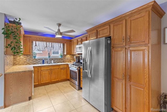 26714 Dover Ct, Warren, MI 48089 - kitchen featuring appliances with stainless steel finishes, backsplash, ceiling fan, brown cabinetry, and light tile patterned floors