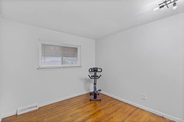 26714 Dover Ct, Warren, MI 48089 - empty room featuring wood finished floors and baseboards