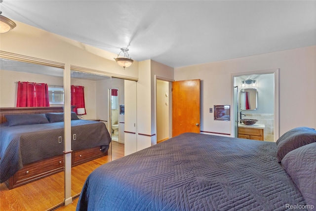 26714 Dover Ct, Warren, MI 48089 - bedroom with light wood-style floors and ensuite bathroom