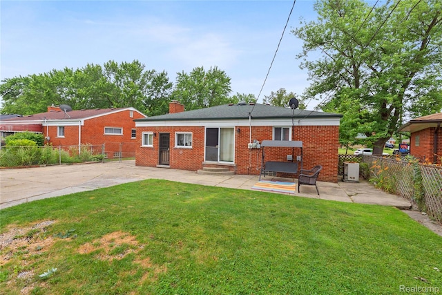 26714 Dover Ct, Warren, MI 48089 - back of property with a patio area, entry steps, a fenced backyard, brick siding, and a chimney