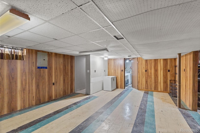 26714 Dover Ct, Warren, MI 48089 - finished basement featuring wood walls, a paneled ceiling, electric panel, and wood finished floors