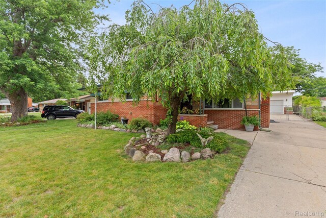 26714 Dover Ct, Warren, MI 48089 - view of front of home featuring a front lawn, brick siding, and driveway