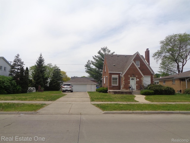 1353 N Gulley Rd, Dearborn Heights, MI 48127 - view of front of home featuring a chimney, a front yard, and brick siding