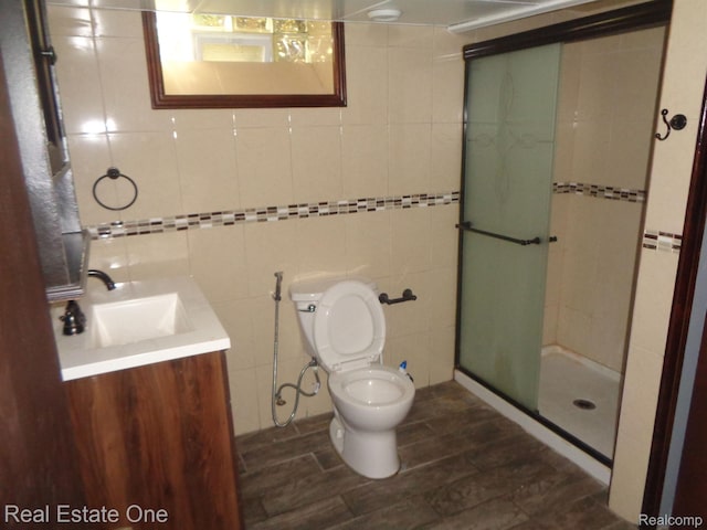 1353 N Gulley Rd, Dearborn Heights, MI 48127 - full bath with vanity, a stall shower, tile walls, and wood finished floors