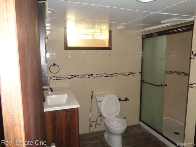 1353 N Gulley Rd, Dearborn Heights, MI 48127 - bathroom featuring vanity, a shower stall, and tile walls