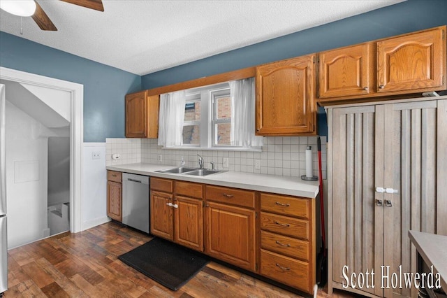 702 Griswold St SE, Grand Rapids, MI 49507 - kitchen with stainless steel dishwasher, ceiling fan, dark wood-style floors, light countertops, and backsplash