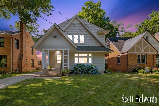702 Griswold St SE, Grand Rapids, MI 49507 - view of front of house with a yard and a porch