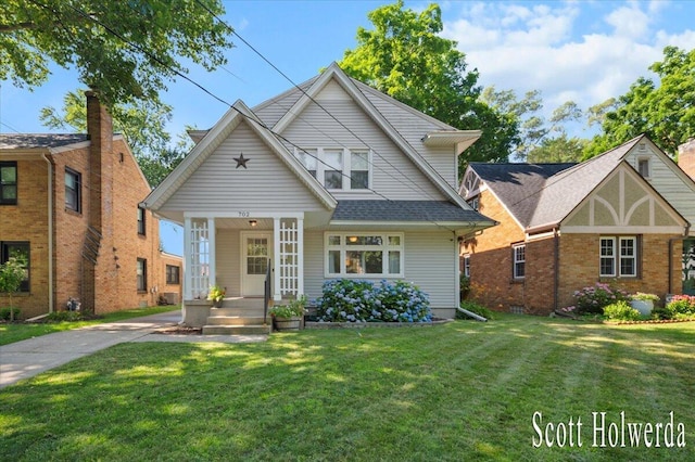 702 Griswold St SE, Grand Rapids, MI 49507 - view of front of home with a front lawn and a porch