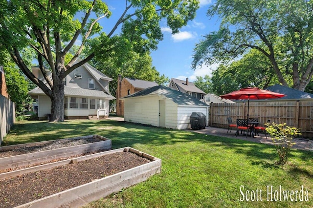702 Griswold St SE, Grand Rapids, MI 49507 - fenced backyard with a vegetable garden, a shed, and a patio area
