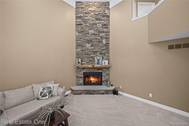 31085 Chatsford St, Novi, MI 48377 - carpeted living area with baseboards and a stone fireplace