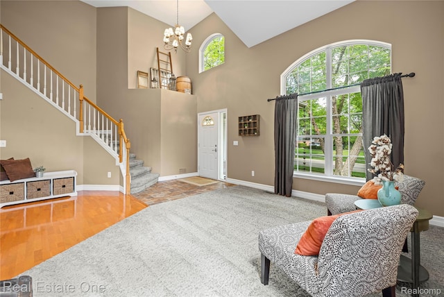 31085 Chatsford St, Novi, MI 48377 - entrance foyer featuring stairs, a high ceiling, a chandelier, and wood finished floors
