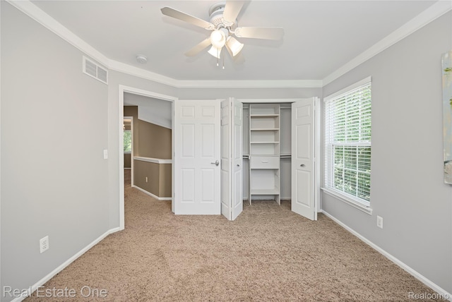 31085 Chatsford St, Novi, MI 48377 - unfurnished bedroom featuring carpet flooring, ornamental molding, ceiling fan, and a closet