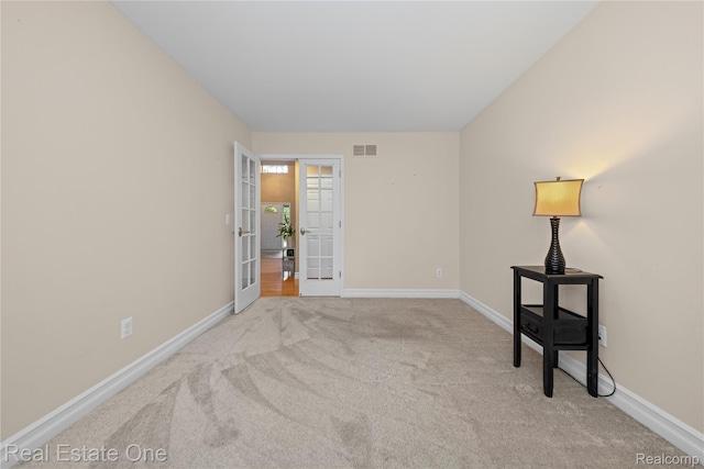 31085 Chatsford St, Novi, MI 48377 - carpeted empty room with french doors and baseboards