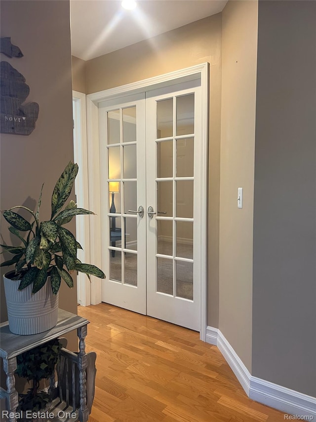 31085 Chatsford St, Novi, MI 48377 - doorway featuring french doors and light wood-style floors