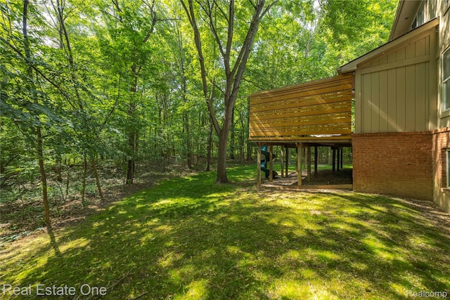 31085 Chatsford St, Novi, MI 48377 - view of green lawn featuring a deck