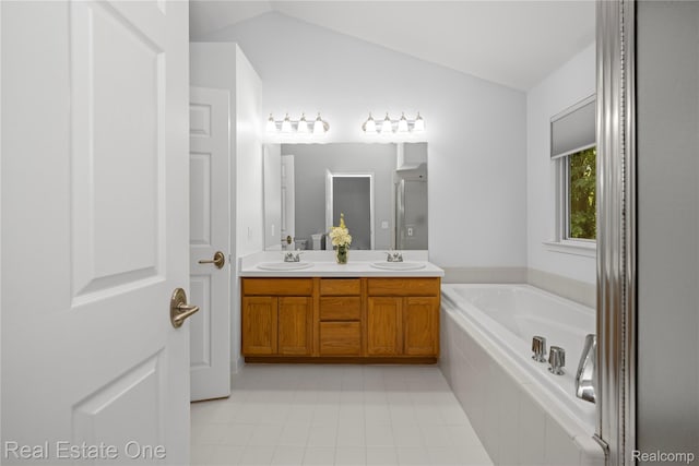 31085 Chatsford St, Novi, MI 48377 - bathroom featuring double vanity, lofted ceiling, a bath, and tile patterned floors