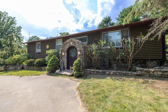 19744 Ivey Rd, Chelsea, MI 48118 - view of front of home with log veneer siding and a front lawn