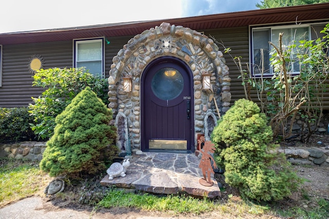 19744 Ivey Rd, Chelsea, MI 48118 - entrance to property with stone siding and faux log siding