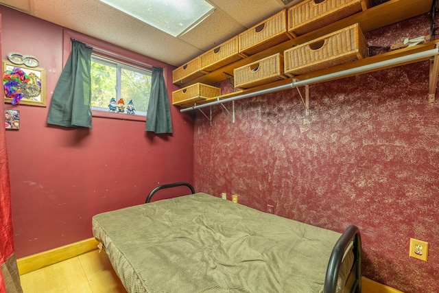 19744 Ivey Rd, Chelsea, MI 48118 - bedroom with wood finished floors and a paneled ceiling