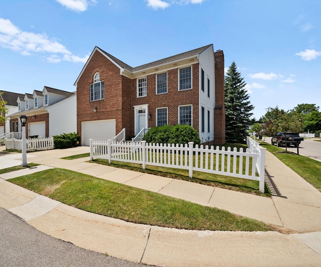 668 Boston Ct, Ann Arbor, MI 48103 - view of front facade with an attached garage, brick siding, concrete driveway, a fenced front yard, and a chimney