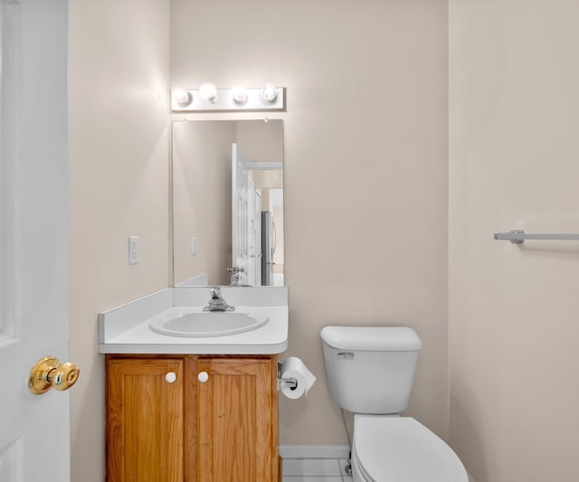 668 Boston Ct, Ann Arbor, MI 48103 - half bathroom with vanity and tile patterned flooring