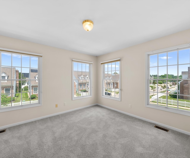 668 Boston Ct, Ann Arbor, MI 48103 - empty room featuring baseboards and carpet flooring