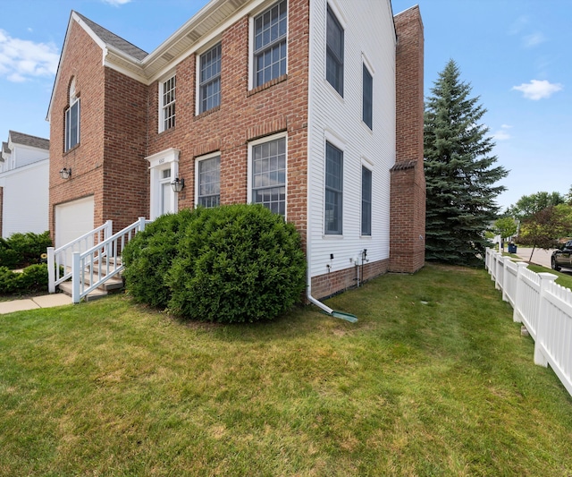 668 Boston Ct, Ann Arbor, MI 48103 - view of front facade with a garage and brick siding