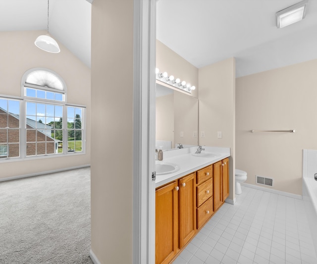 668 Boston Ct, Ann Arbor, MI 48103 - bathroom with double vanity, lofted ceiling, a bathtub, and tile patterned floors