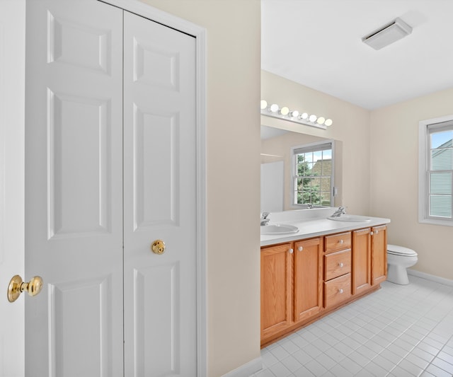 668 Boston Ct, Ann Arbor, MI 48103 - full bath with double vanity and tile patterned floors