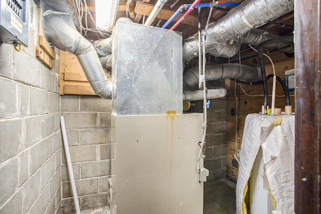 565 E Rockford Rd, Idlewild, MI 49642 - utility room with water heater