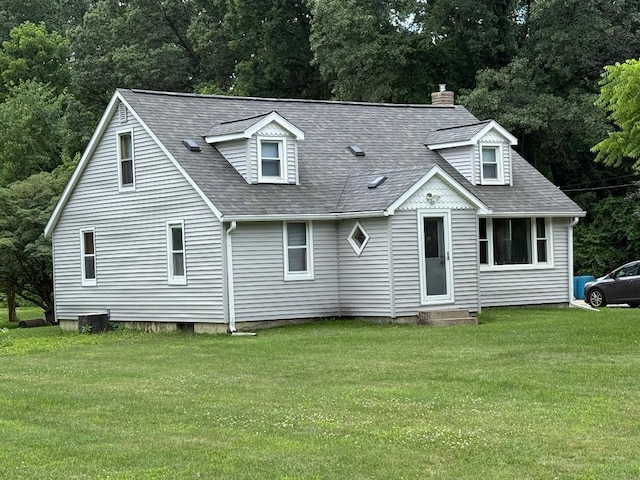 226 Poulsen Ave, Battle Creek, MI 49014 - view of front of house with a front lawn, roof with shingles, and a chimney