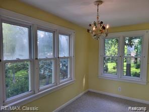 17951 Prospect St, Dearborn Heights, MI 48122 - unfurnished dining area featuring a chandelier and carpet floors