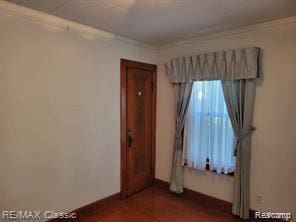 17951 Prospect St, Dearborn Heights, MI 48122 - empty room featuring crown molding and dark wood finished floors
