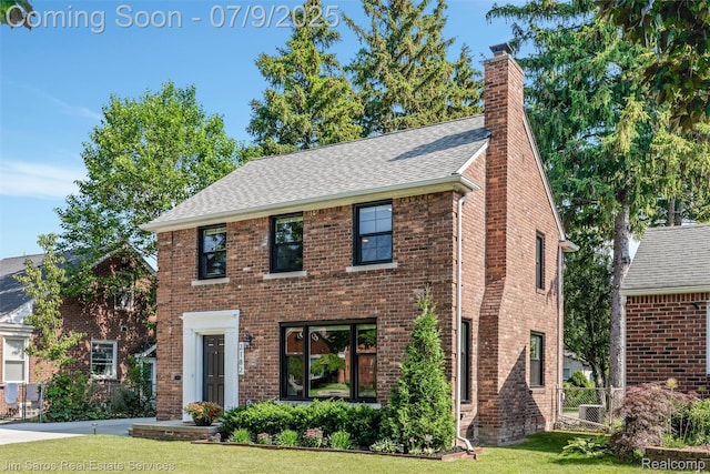 2182 Hawthorne Rd, Detroit, MI 48236 - view of front facade featuring a chimney, roof with shingles, and brick siding