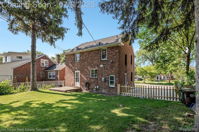 2182 Hawthorne Rd, Detroit, MI 48236 - back of house featuring brick siding and a fenced backyard