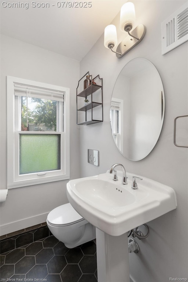 2182 Hawthorne Rd, Detroit, MI 48236 - bathroom featuring tile patterned floors and toilet