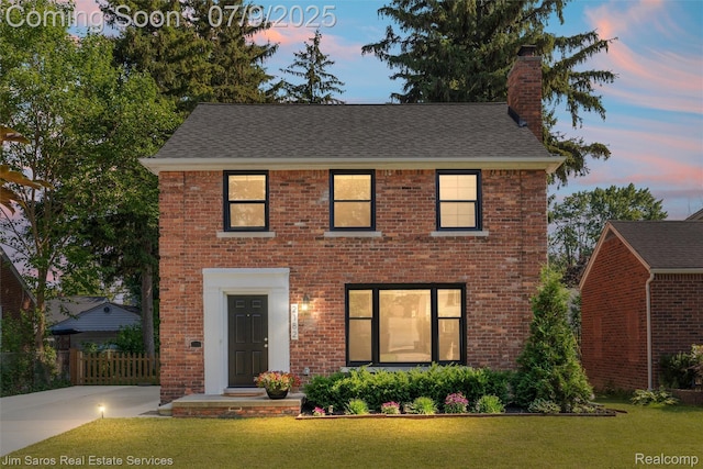 2182 Hawthorne Rd, Detroit, MI 48236 - view of front of home with brick siding, a chimney, and a shingled roof