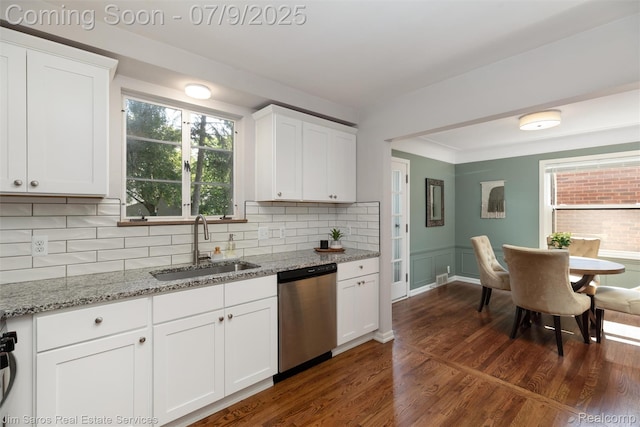 2182 Hawthorne Rd, Detroit, MI 48236 - kitchen with dishwasher, dark wood-type flooring, backsplash, white cabinets, and light stone counters