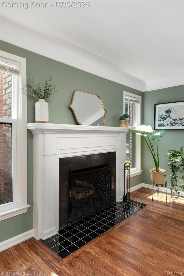 2182 Hawthorne Rd, Detroit, MI 48236 - living room with a fireplace and wood finished floors
